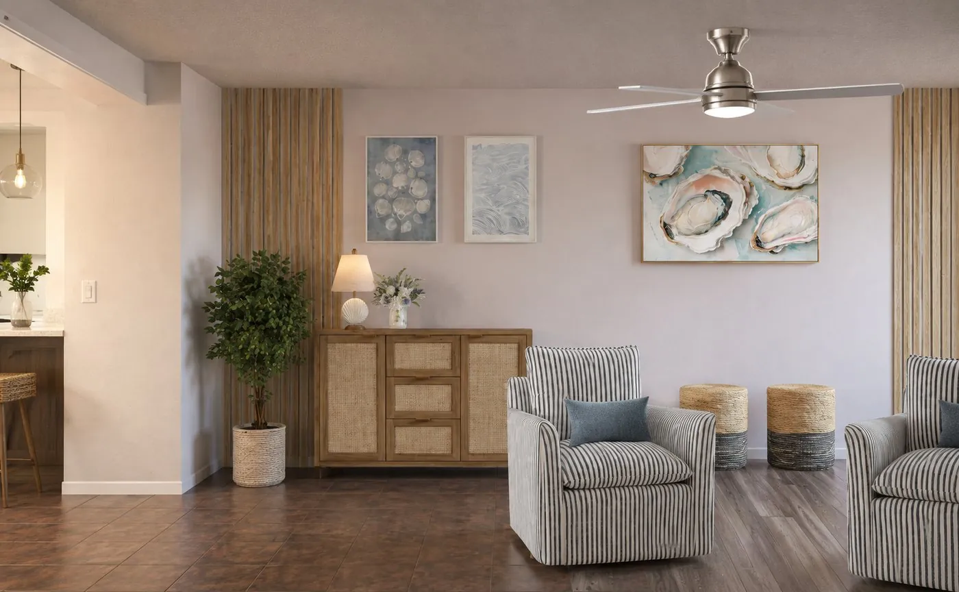 Living room seating corner with oyster artwork, rattan sideboard and slatted wood panels